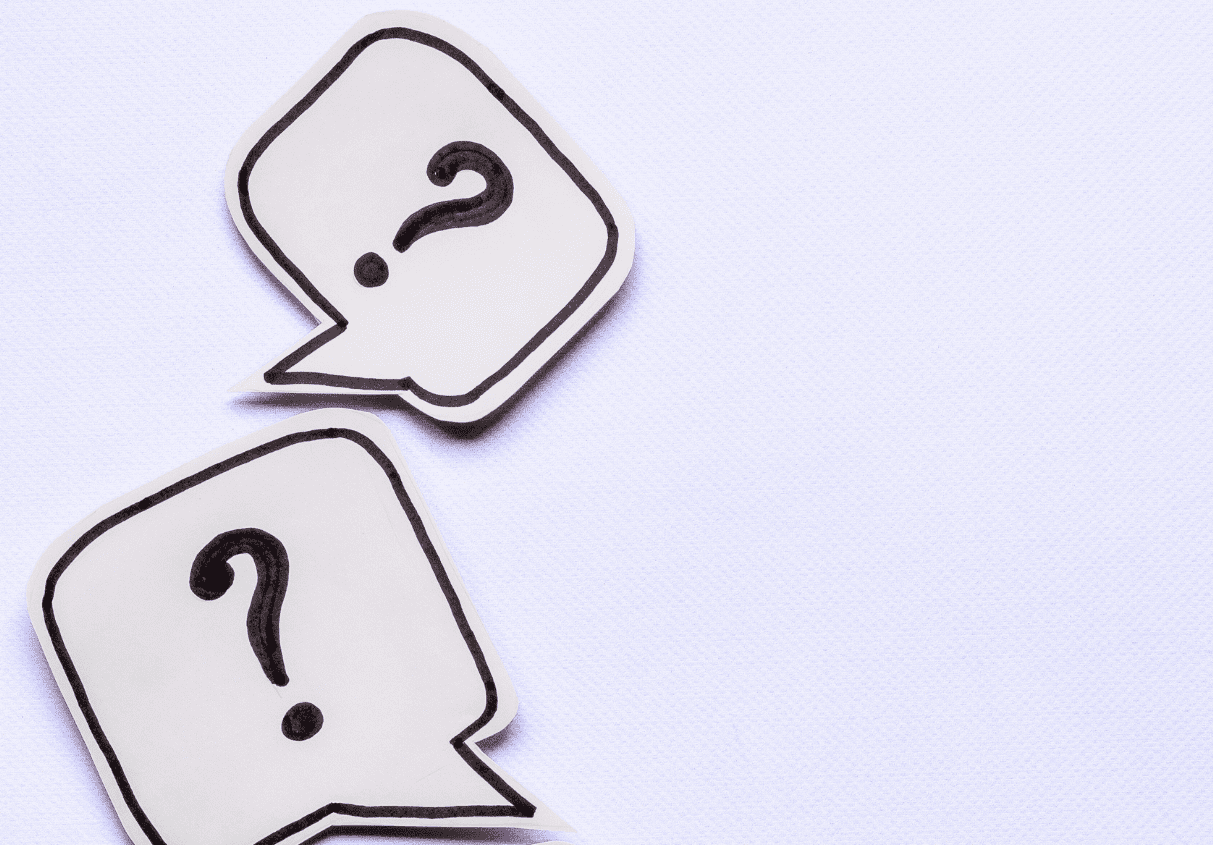 Three speech bubbles each with a question mark inside